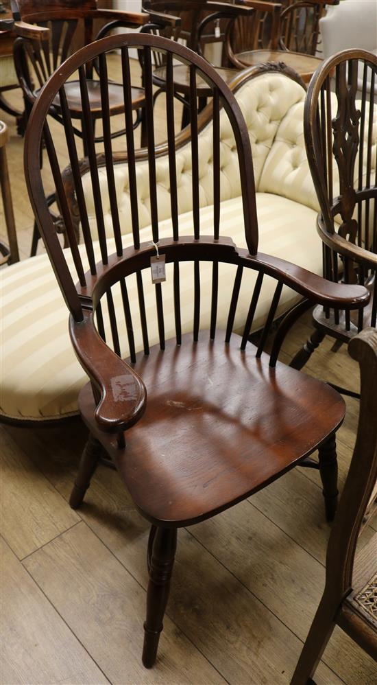 A Windsor style stick back kitchen elbow chair